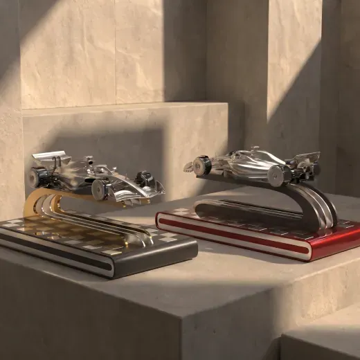 Model racing cars mounted on presentation bases