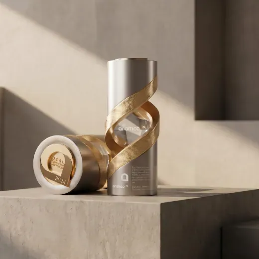 Cylindrical silver award wrapped in a gold ribbon